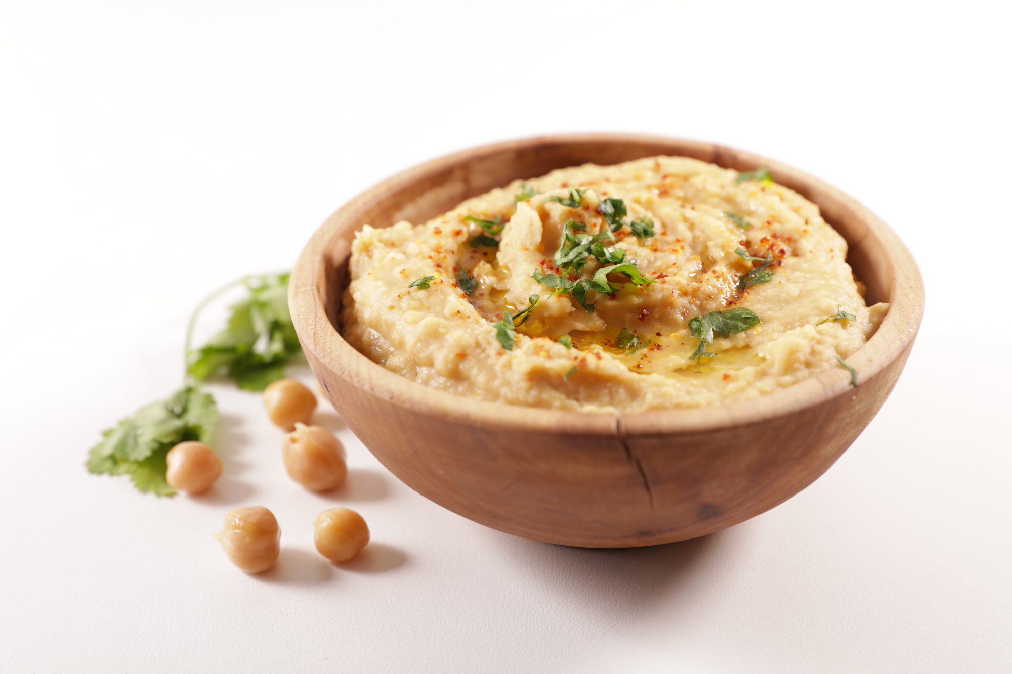 bowl of hummus on white background